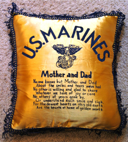 gold pillow with a prayer to parents from a marine stiched on the front